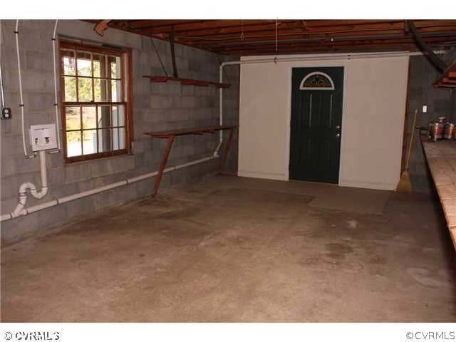 3008 Osborne Road Chester, VA 23831 - Photo 10 of 12 a view of an empty room with wooden floor