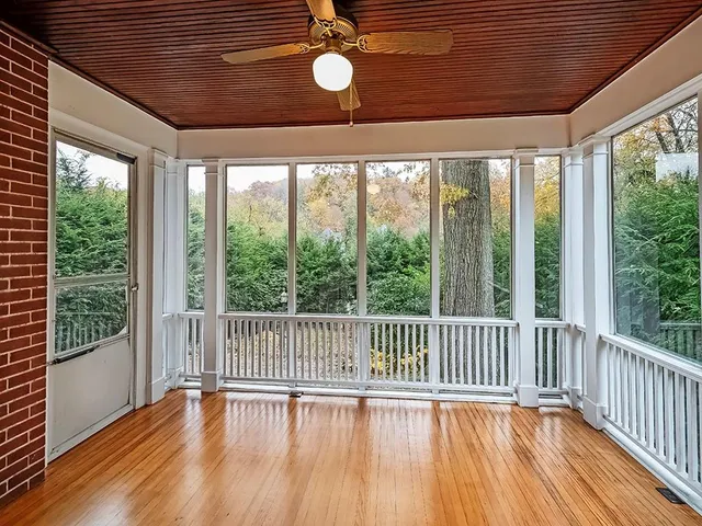a view of a porch with wooden floor
