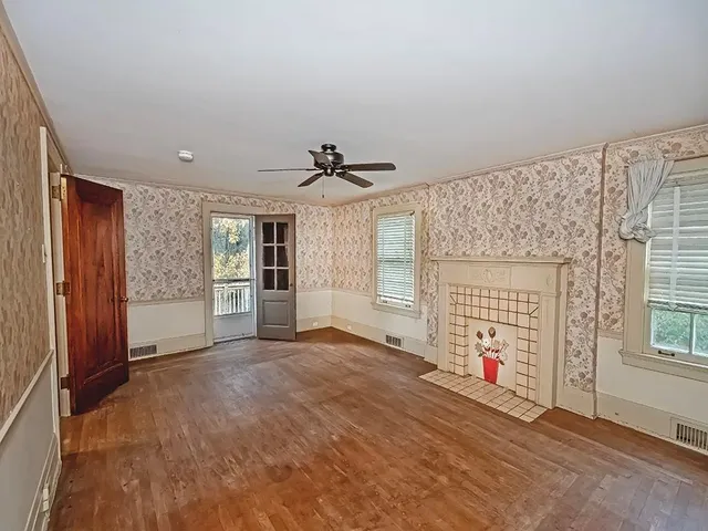 a view of an empty room with a window