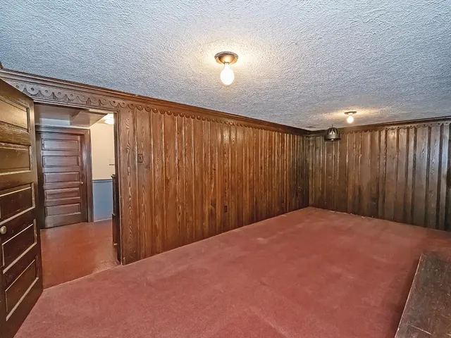 a view of a room with a wooden walls
