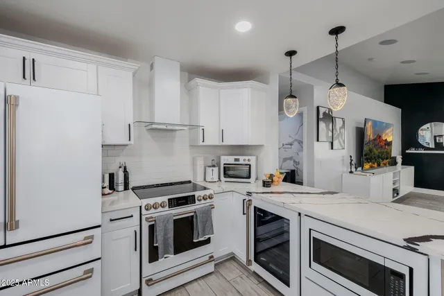 a bed room with a bed and a painting on the wall