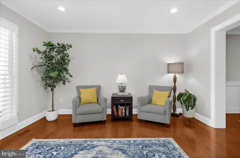 a dining room with a table and chairs