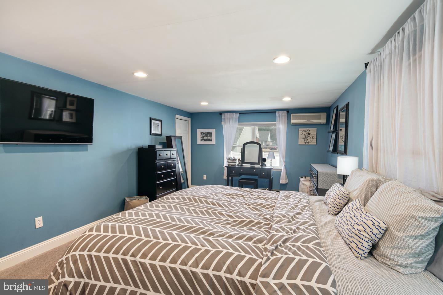 1025 Chesterfield Road Barrington, NJ 08033 - Photo 21 of 32 a bedroom with a large bed and a tv