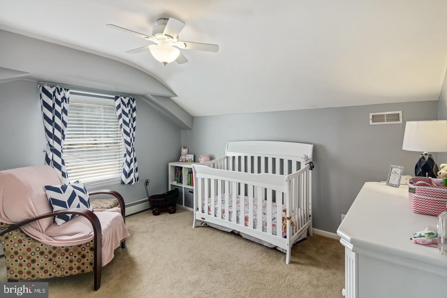 1025 Chesterfield Road Barrington, NJ 08033 - Photo 25 of 32 a bedroom with a bed and a chandelier