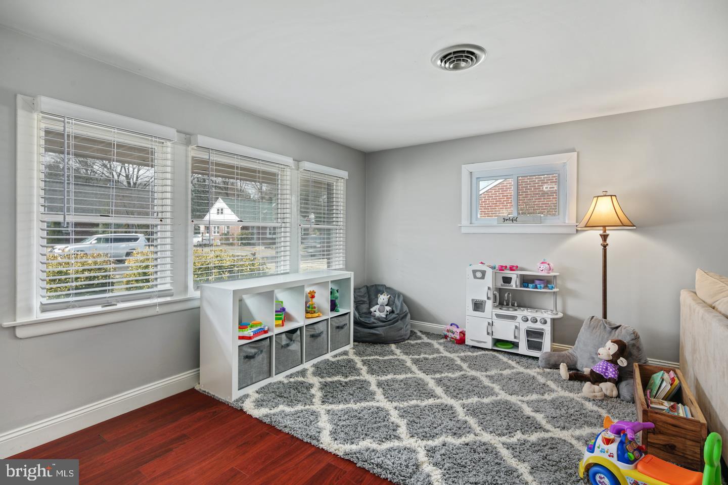1025 Chesterfield Road Barrington, NJ 08033 - Photo 6 of 32 a living room with baby crib furniture and a window
