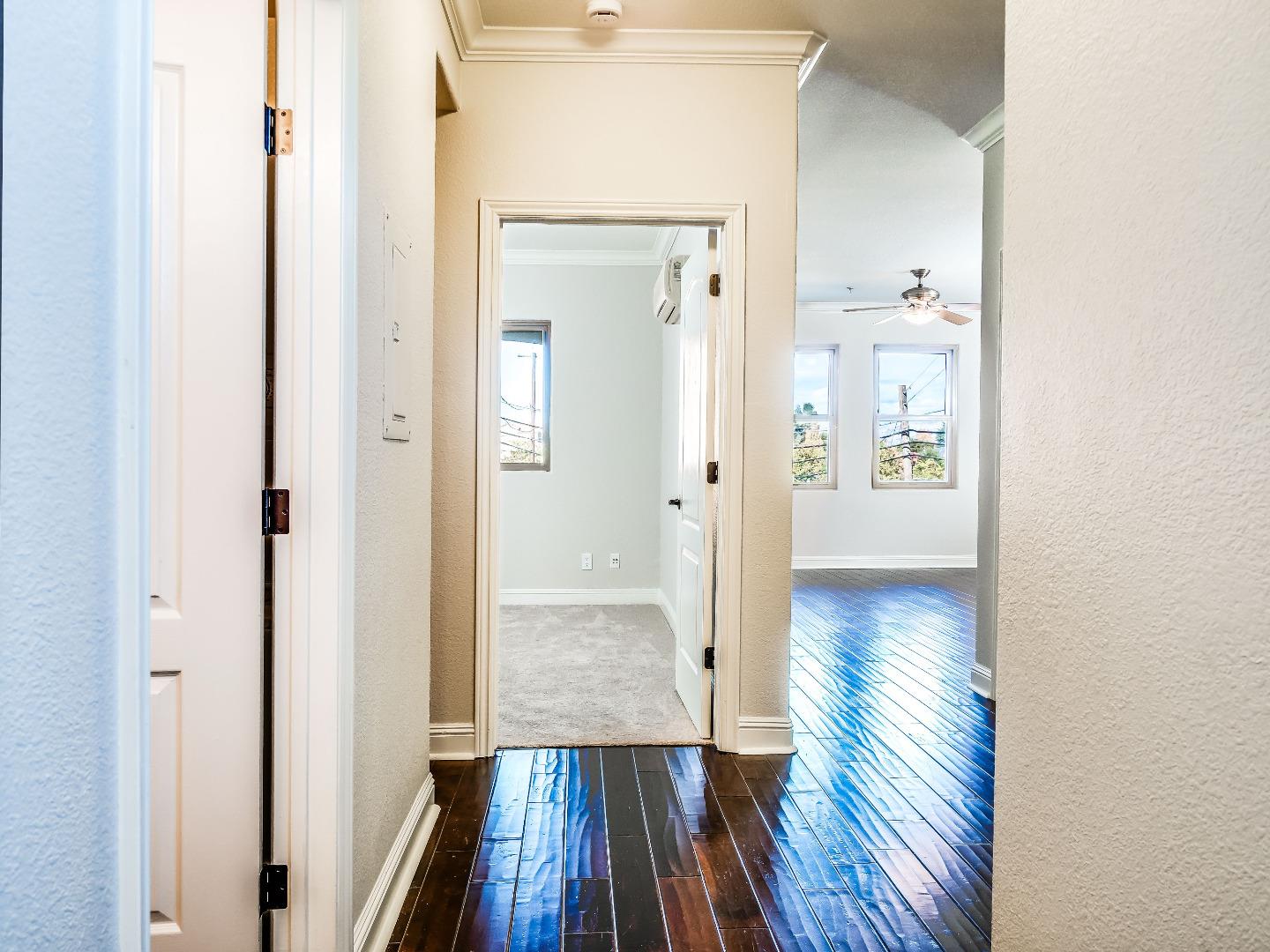 7598 Monterey Road, Unit 260 Gilroy, CA 95020 - Photo 7 of 26 a view of a hallway with wooden floor
