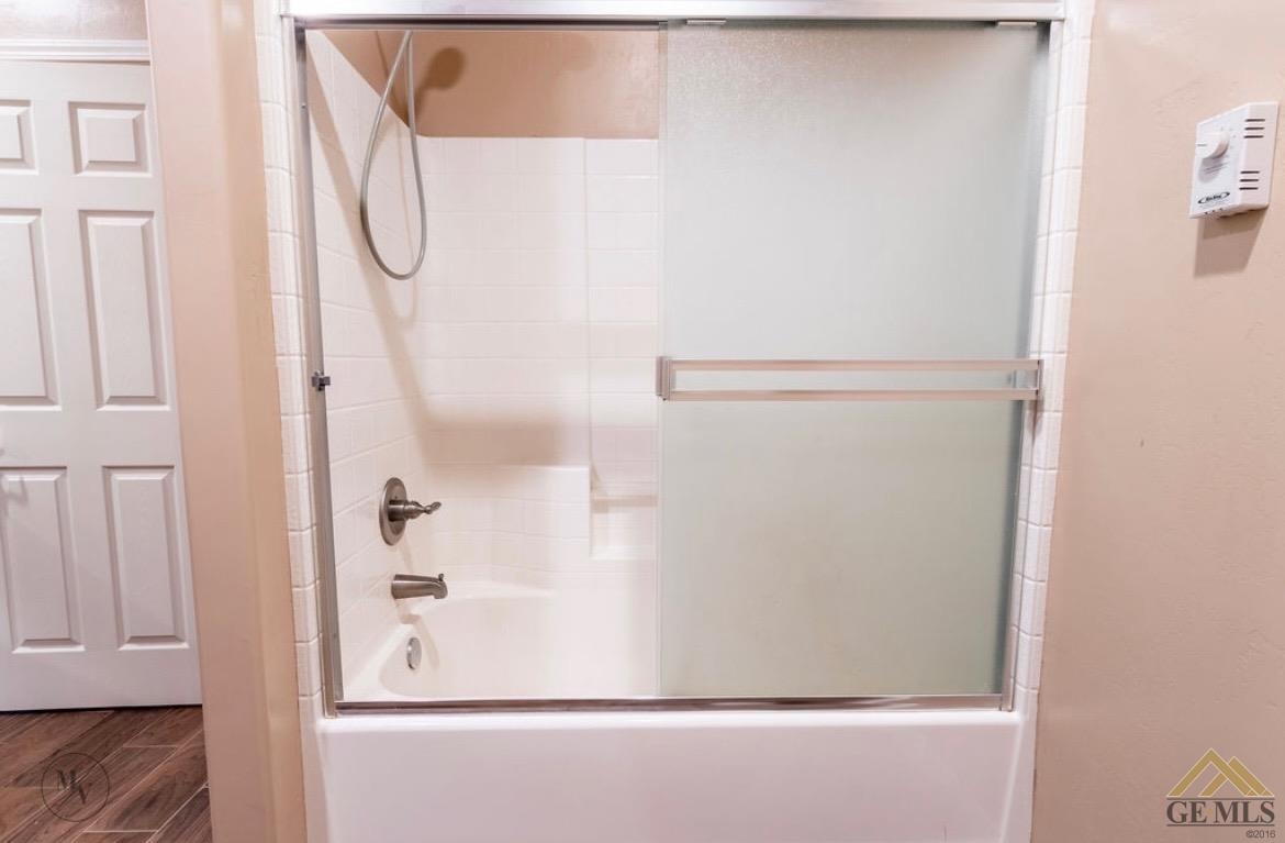 Undisclosed Address Wasco, CA 93280 - Photo 13 of 28 a bathroom with a shower