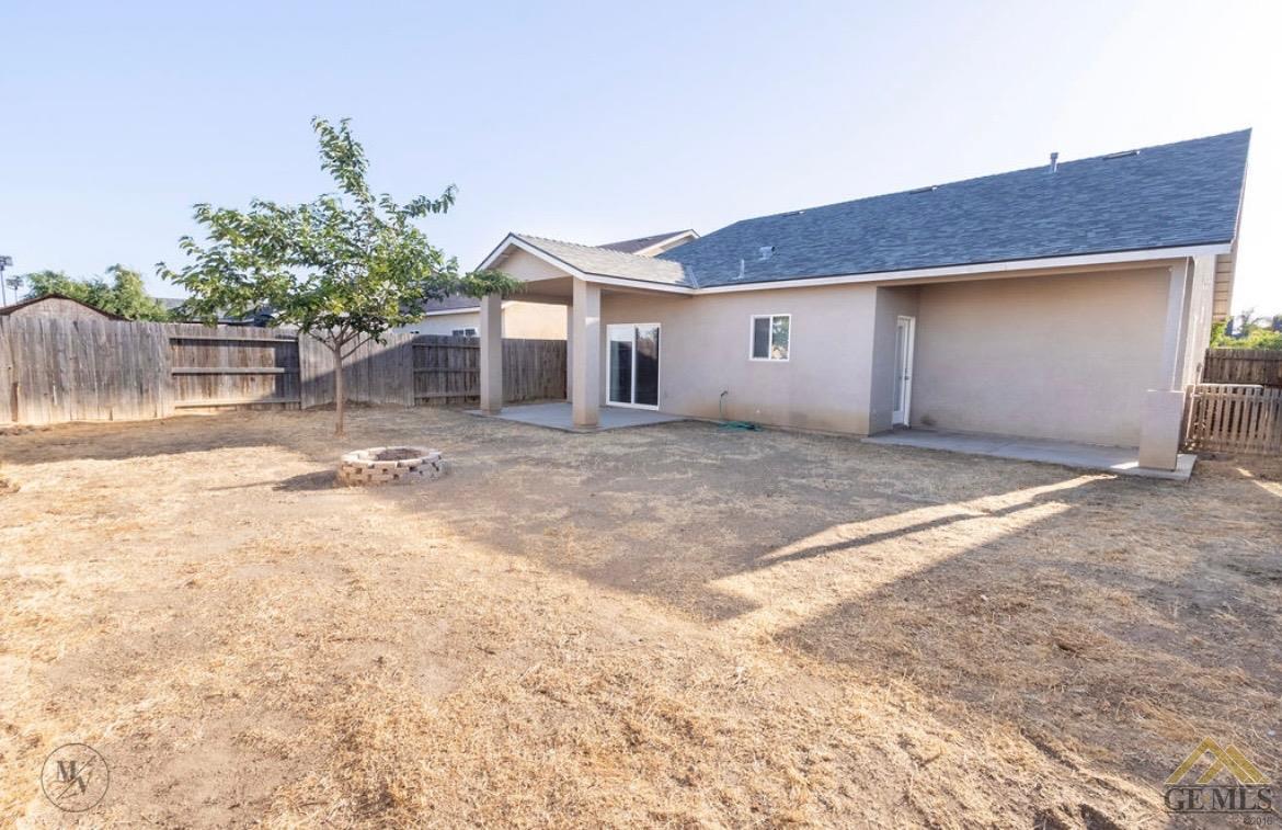 Undisclosed Address Wasco, CA 93280 - Photo 26 of 28 a view of a house with a yard