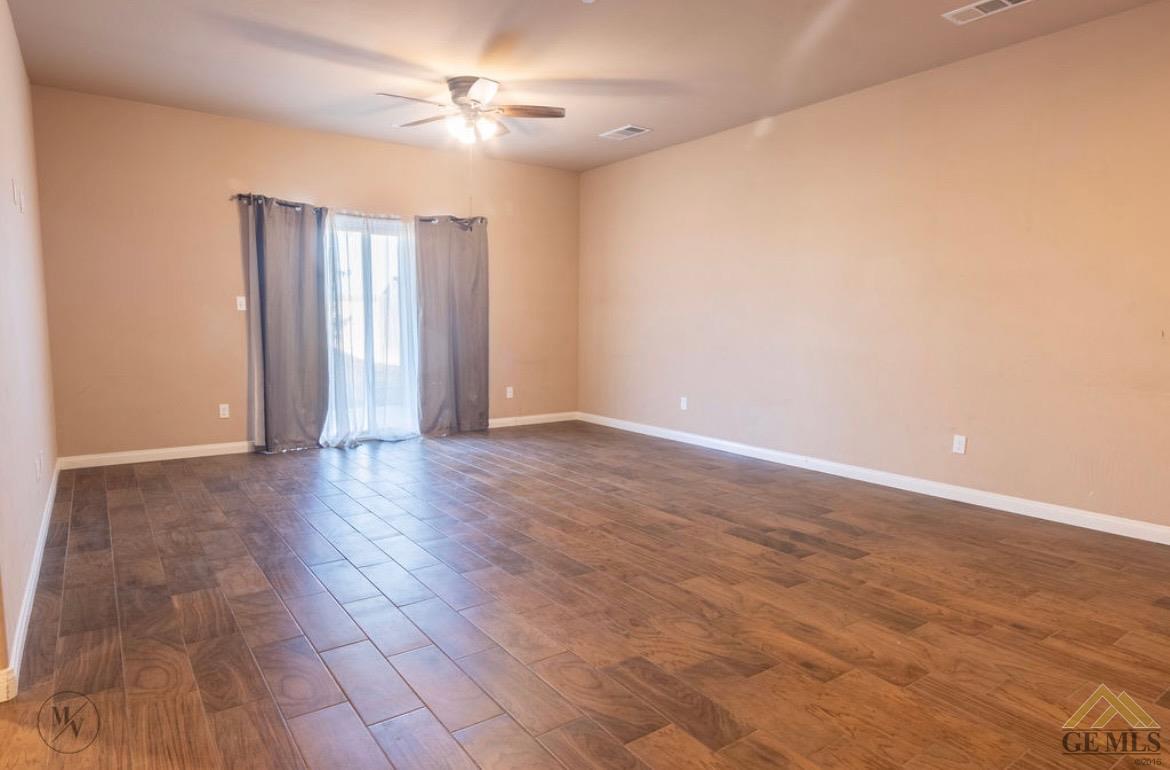 Undisclosed Address Wasco, CA 93280 - Photo 6 of 28 a view of an empty room with a window