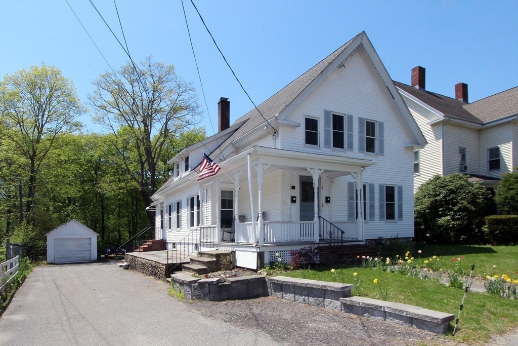 2 High Street Middleboro, MA 02346 - Photo 4 of 41 a view of a white house with a chairs in a patio