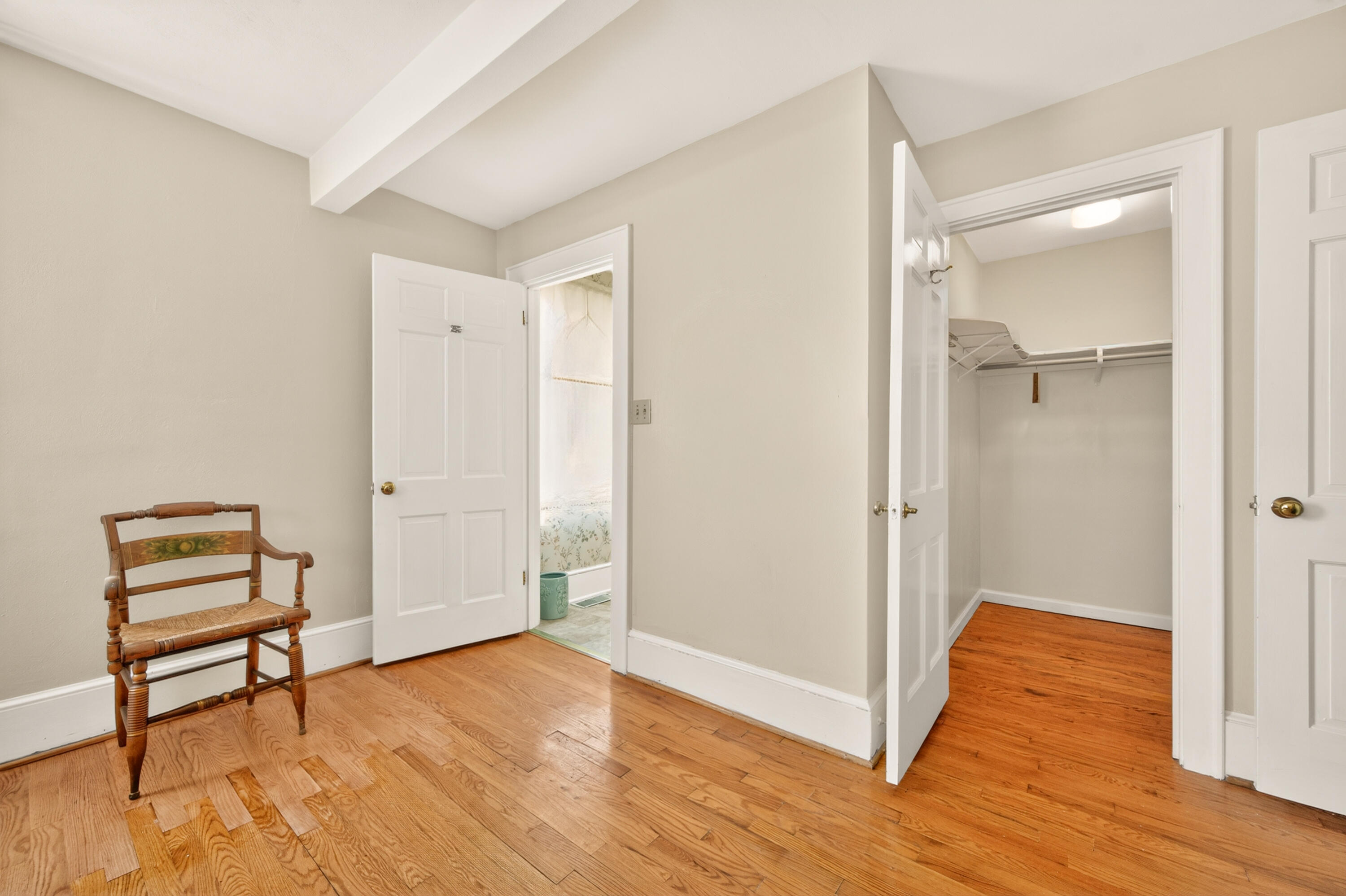 4322 Rosecrest Road Roanoke, VA 24018 - Photo 27 of 36 a view of an empty room with wooden floor and a window