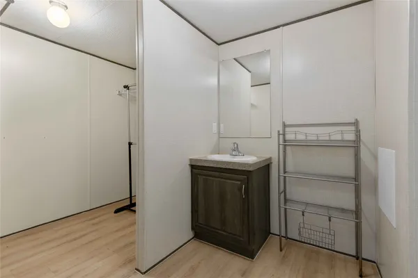 a bathroom with a sink and mirror