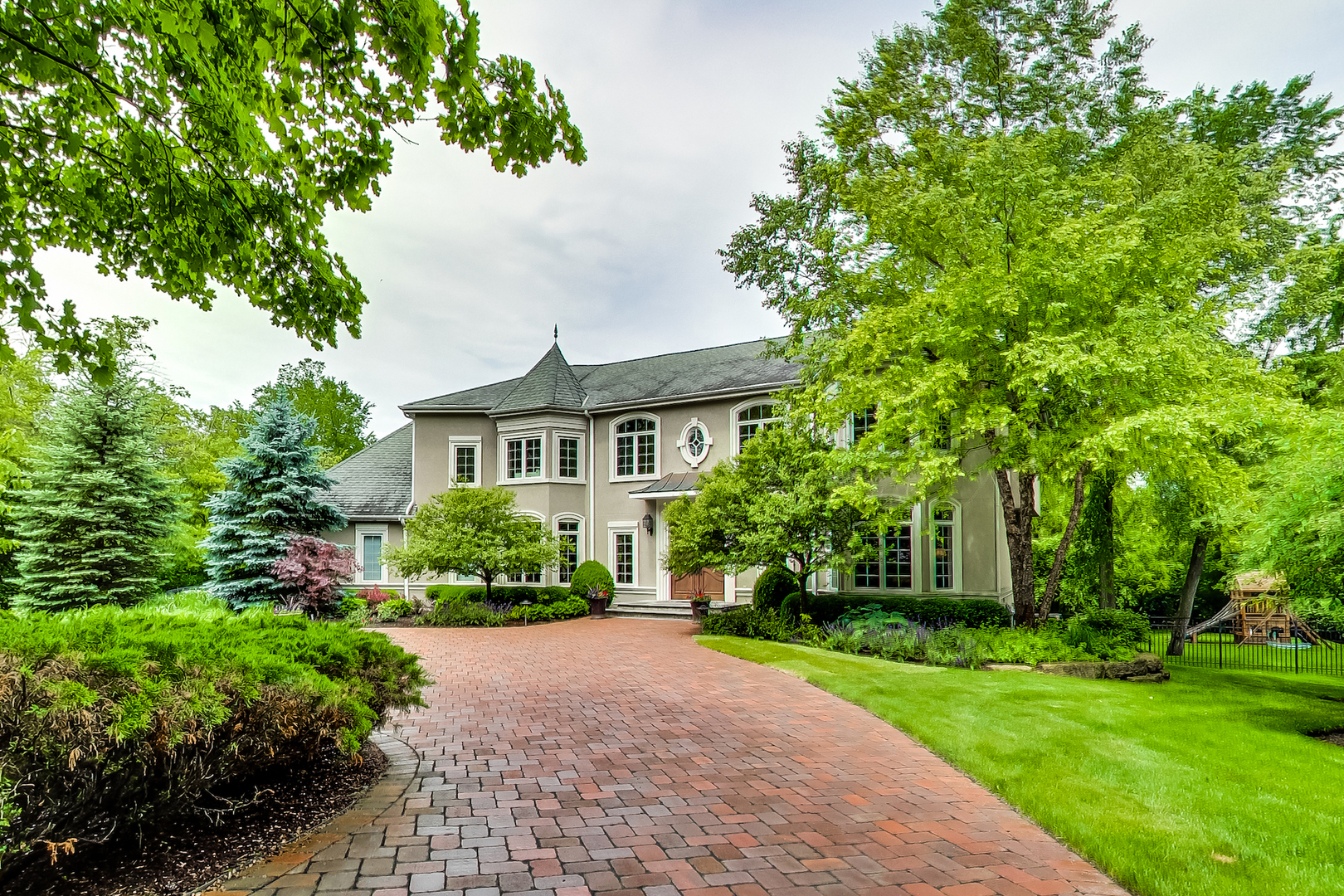 4289 Hilltop Road Long Grove, IL 60047 - Photo 1 of 42 a front view of a house with a yard and green space