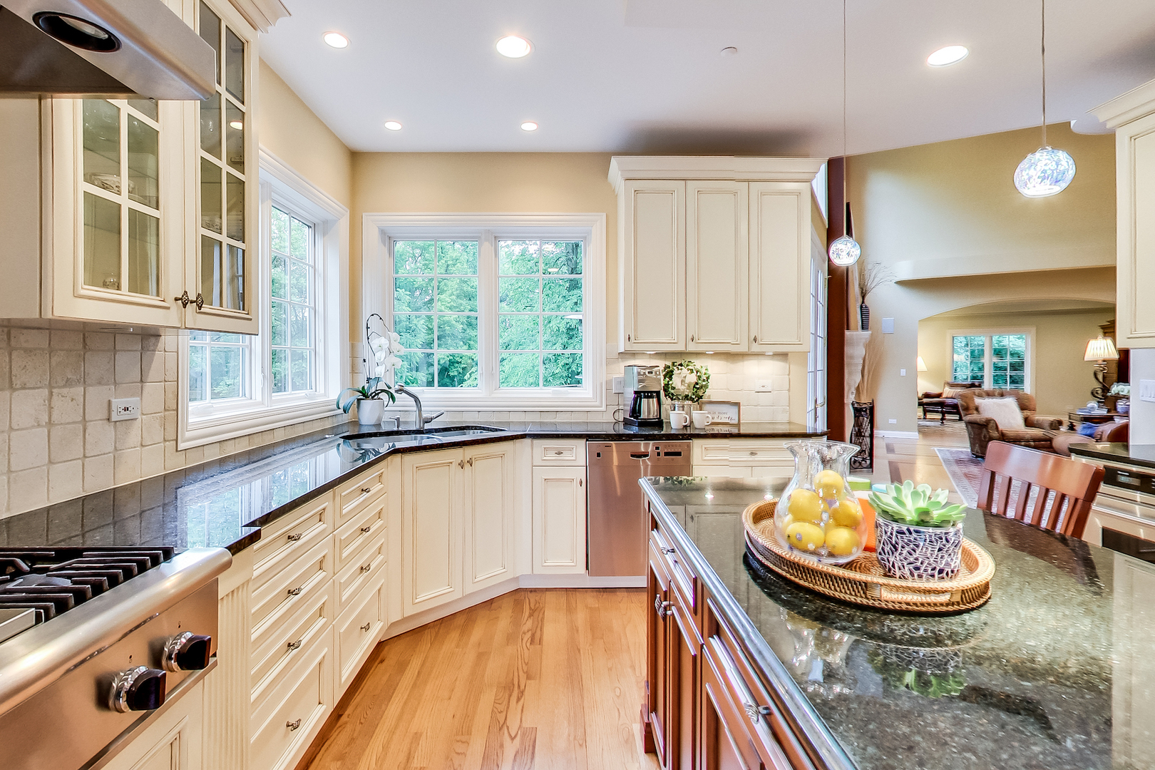 4289 Hilltop Road Long Grove, IL 60047 - Photo 14 of 42 a kitchen with a stove a sink and a wooden cabinets
