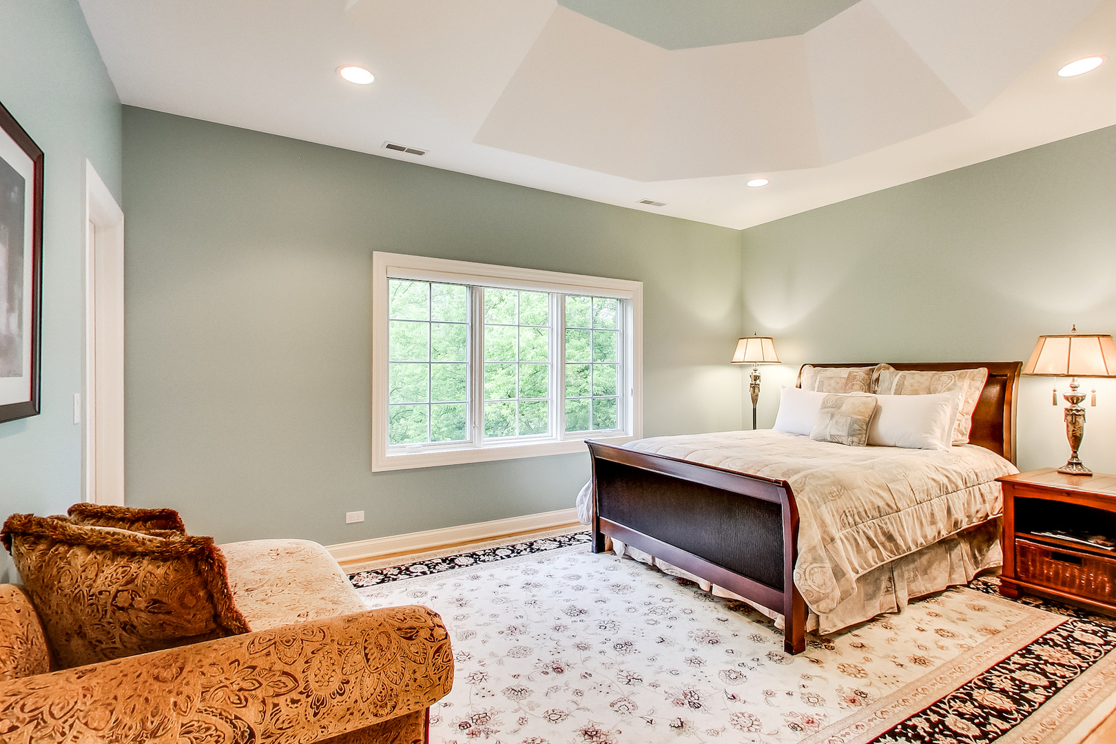 4289 Hilltop Road Long Grove, IL 60047 - Photo 24 of 42 a spacious bedroom with a bed and a couch