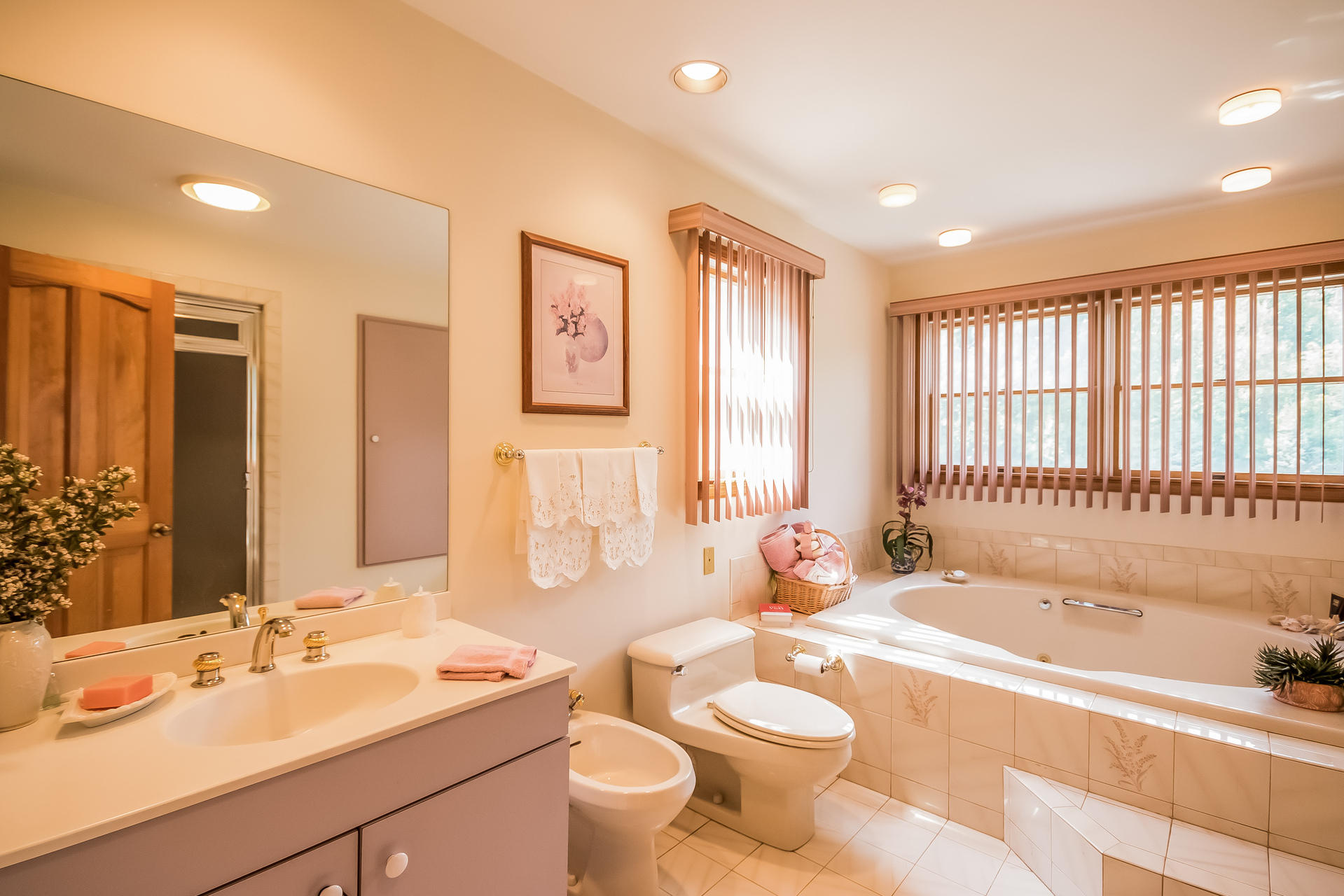 604 Ponus Ridge Road New Canaan, CT 06840 - Photo 14 of 38 a spacious bathroom with a double vanity sink toilet mirror and bathtub