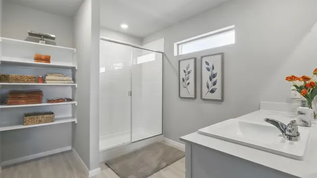 a bedroom with a large bed and a couch