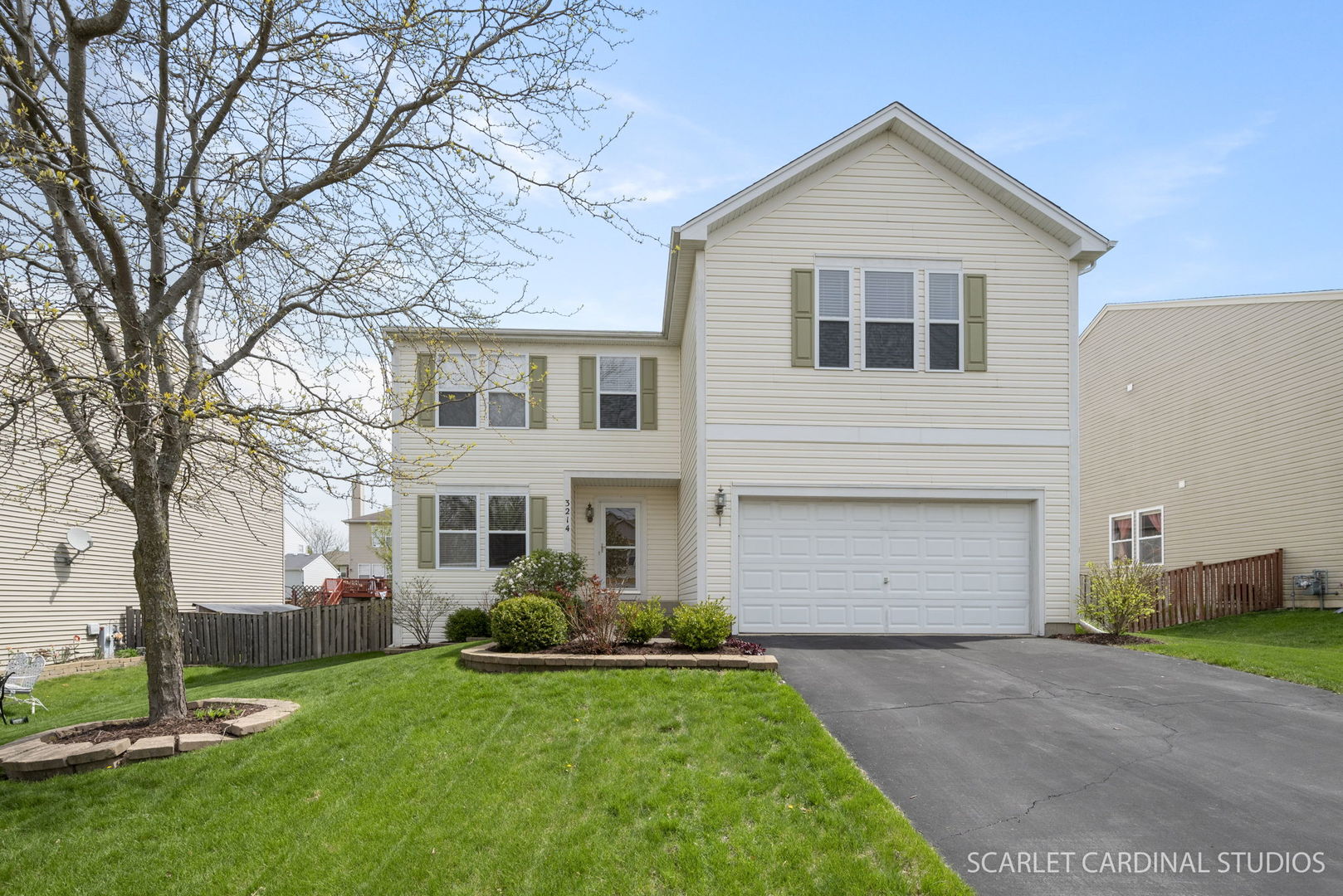 3214 Marbill Farm Road Montgomery, IL 60538 - Photo 1 of 27 a front view of a house with a yard and garage