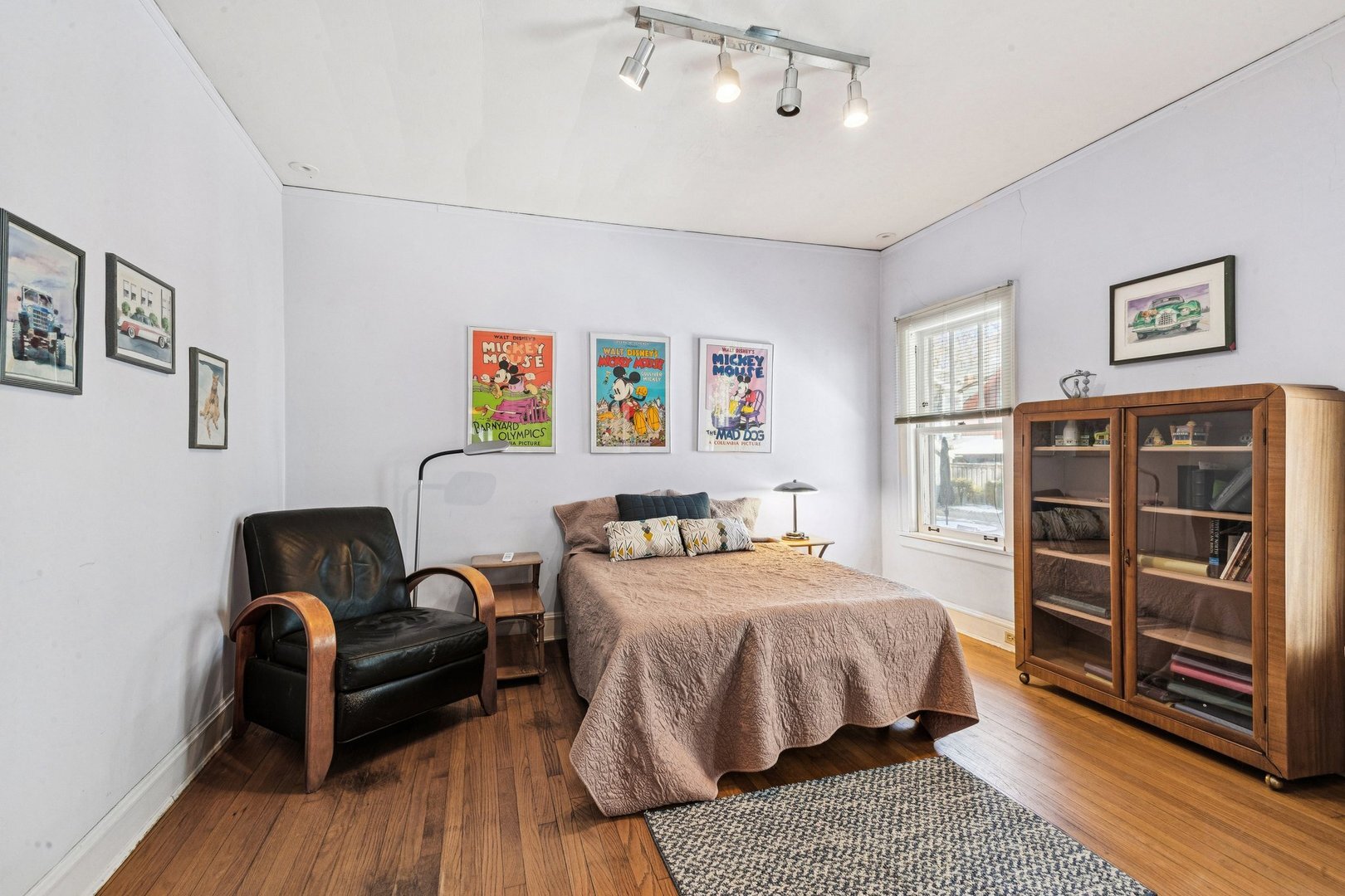 1201 Noyes Street Evanston, IL 60201 - Photo 25 of 50 a bedroom with a bed and wooden floor