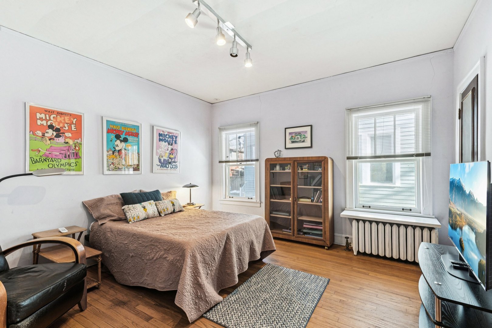 1201 Noyes Street Evanston, IL 60201 - Photo 26 of 50 a bedroom with a bed wooden floor and window