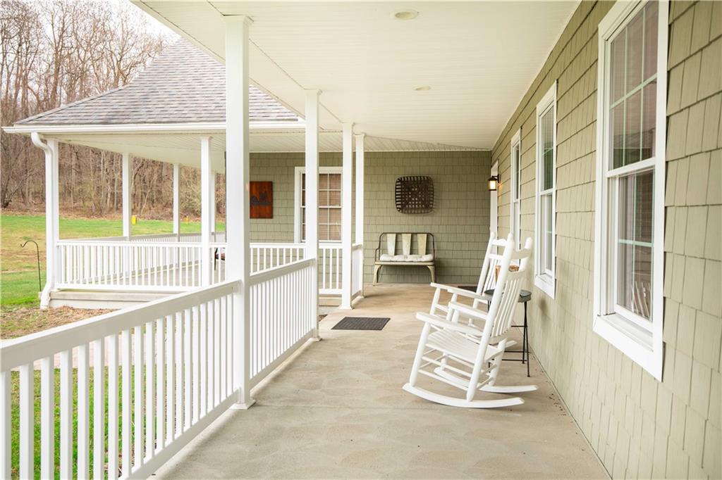 262 Windy Point Road Harrisville, PA 16038 - Photo 13 of 38 a view of a chair and table in the balcony