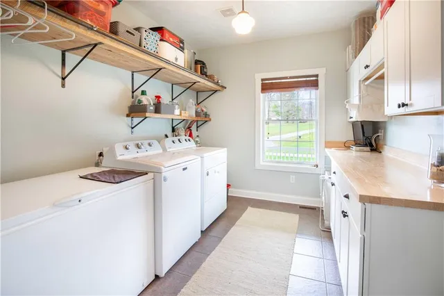 a utility room with dryer and washer