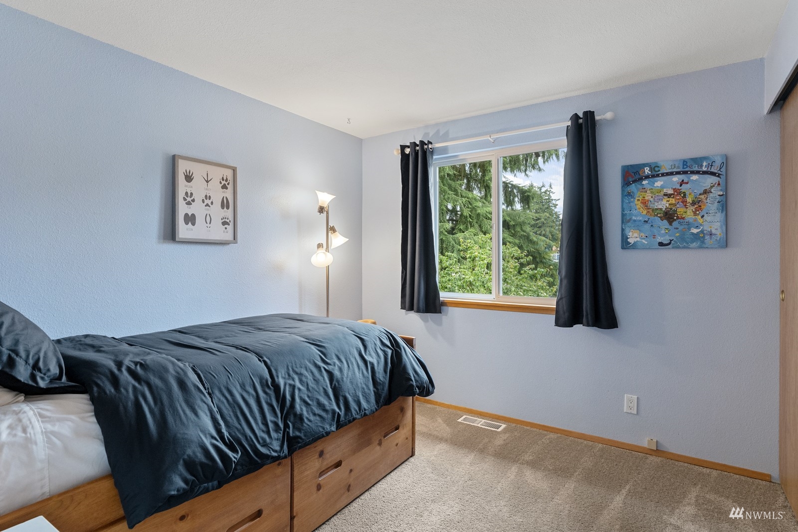 9651 Northeast 201st Street Bothell, WA 98011 - Photo 16 of 39 a bedroom with a bed and a window