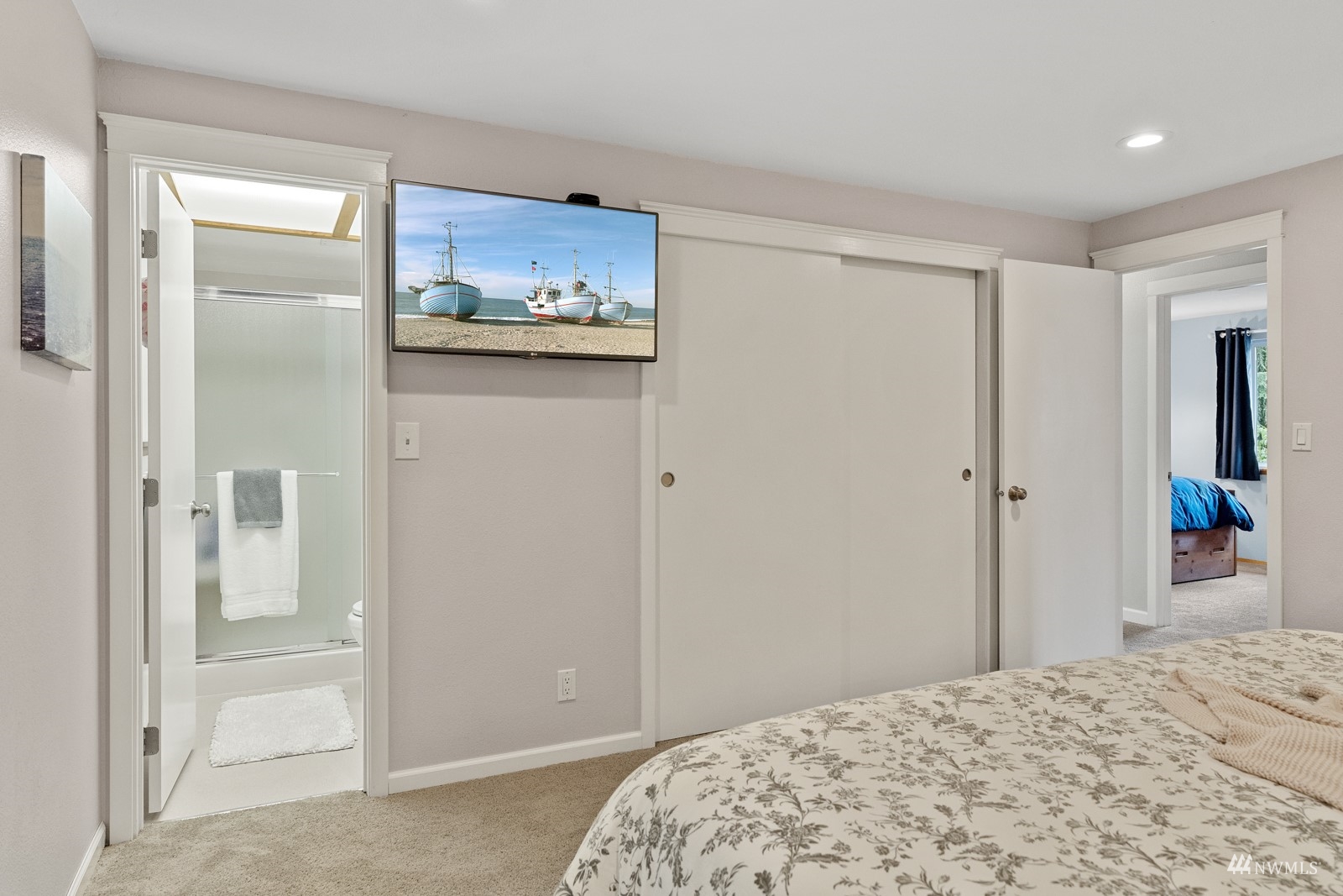 9651 Northeast 201st Street Bothell, WA 98011 - Photo 20 of 39 a bedroom with a bed and a painting on the wall