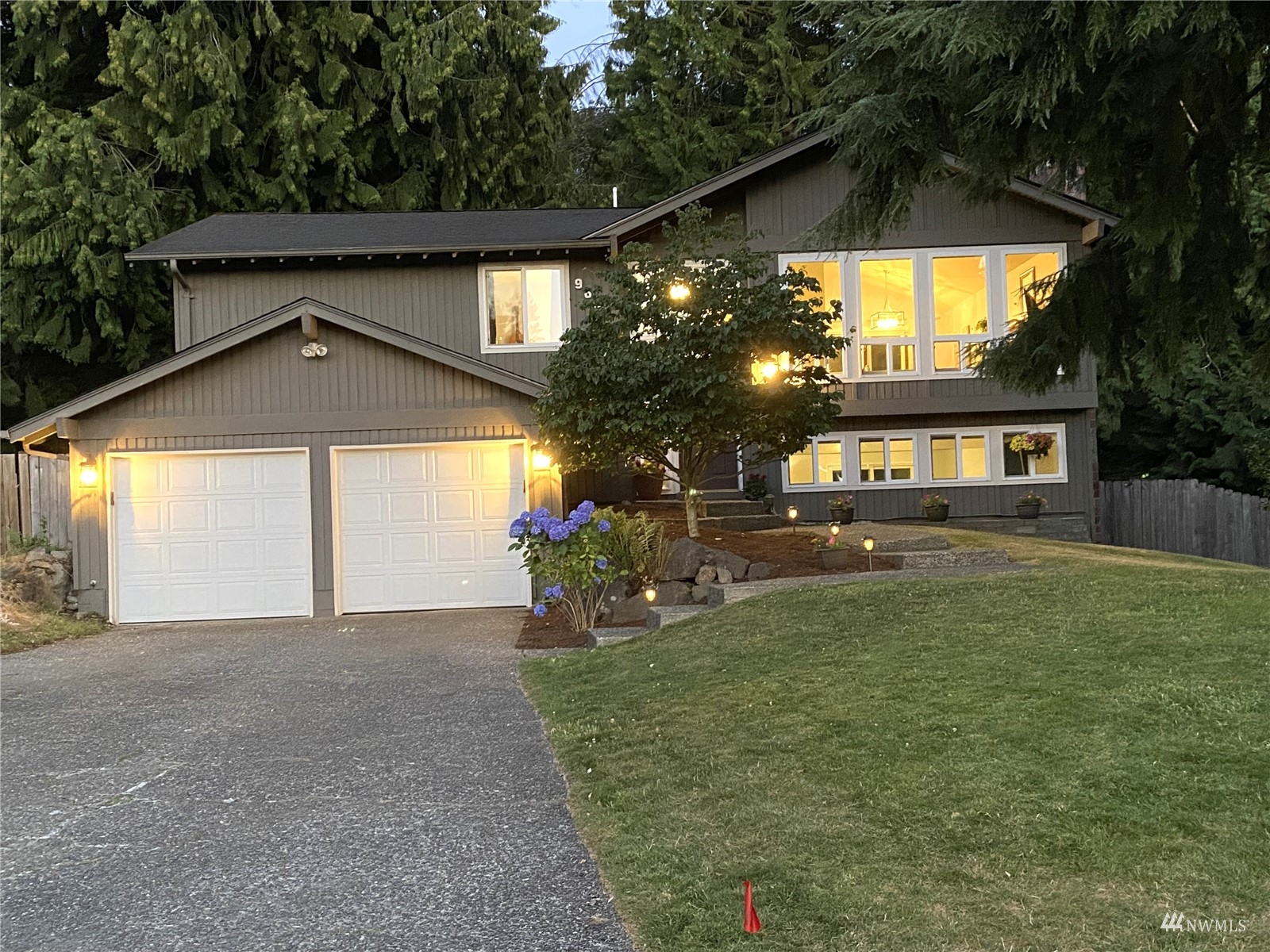 9651 Northeast 201st Street Bothell, WA 98011 - Photo 2 of 39 a front view of a house with a yard