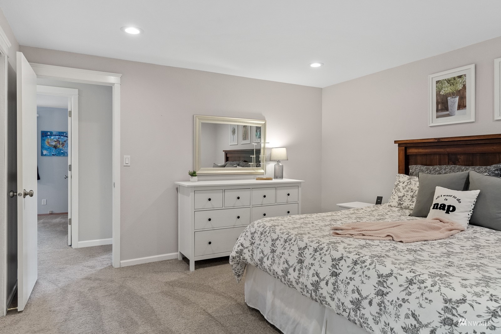 9651 Northeast 201st Street Bothell, WA 98011 - Photo 21 of 39 a bedroom with a bed and a dresser