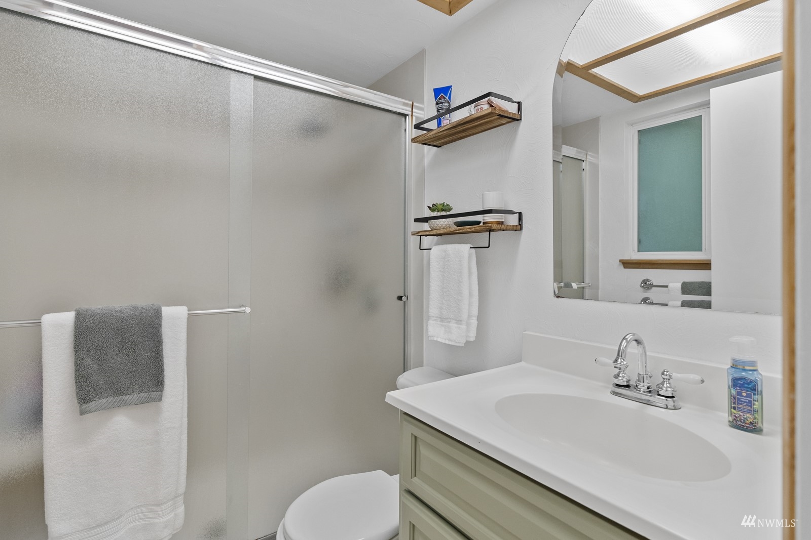 9651 Northeast 201st Street Bothell, WA 98011 - Photo 22 of 39 a bathroom with a sink toilet and shower