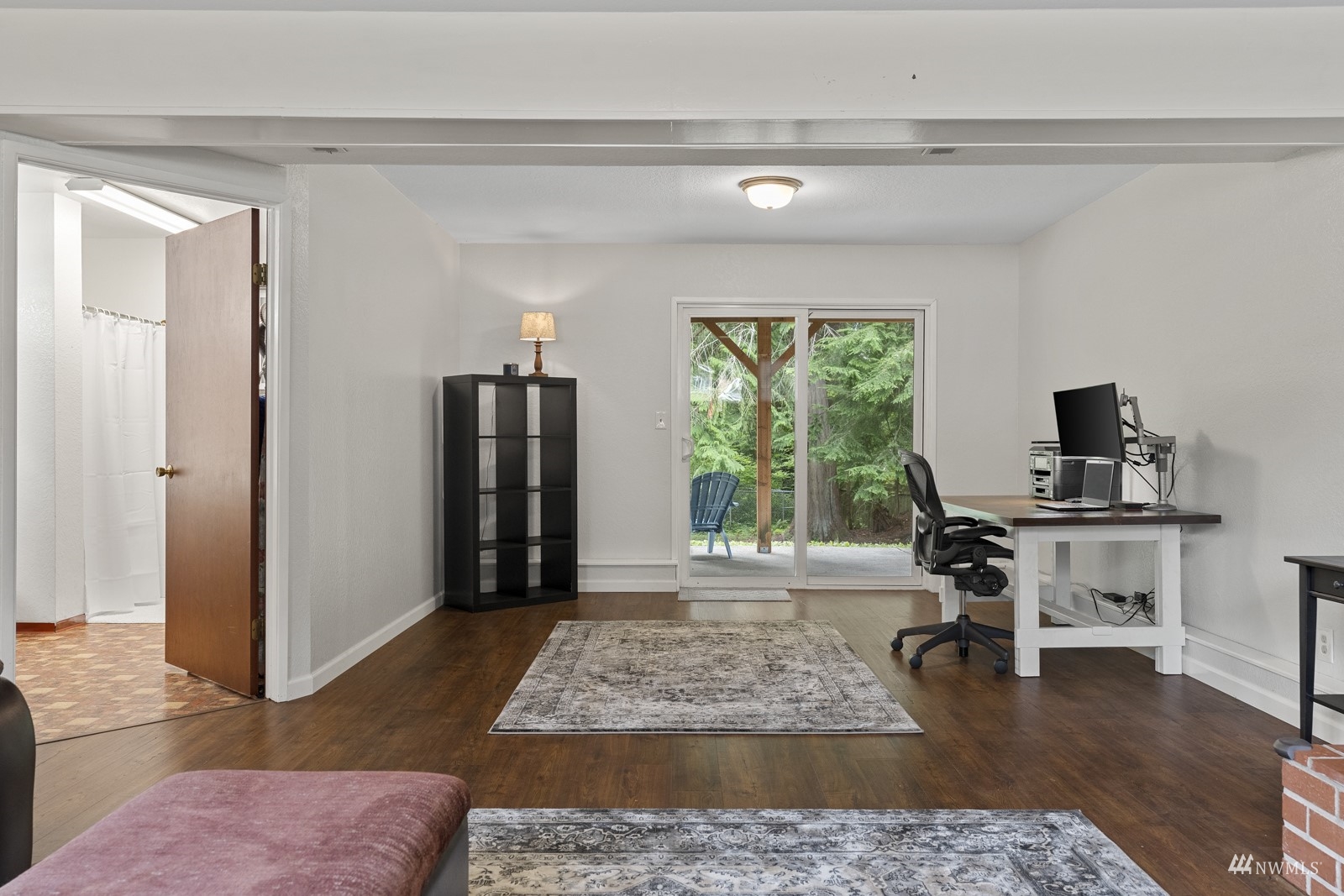 9651 Northeast 201st Street Bothell, WA 98011 - Photo 29 of 39 a view of a livingroom with wooden floor and a rug