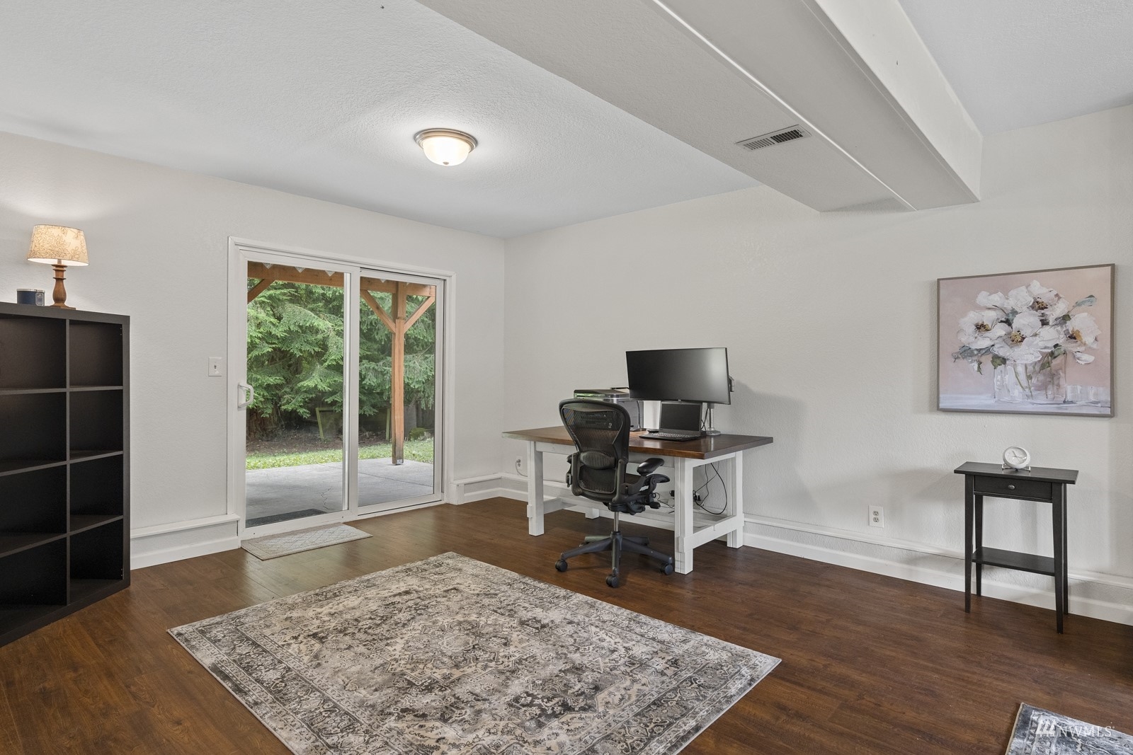 9651 Northeast 201st Street Bothell, WA 98011 - Photo 30 of 39 a living room with furniture rug and a floor to ceiling window