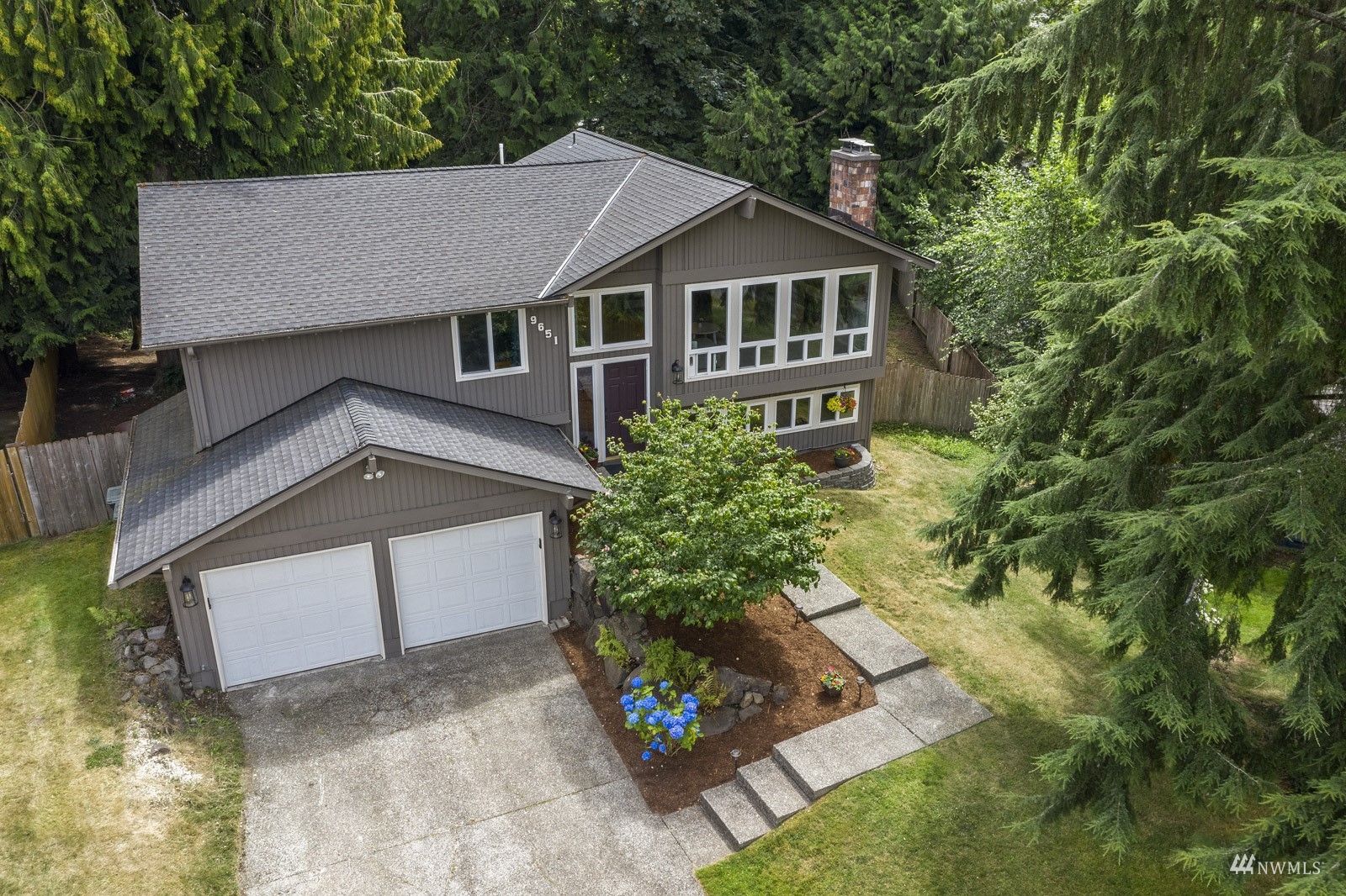 9651 Northeast 201st Street Bothell, WA 98011 - Photo 3 of 39 a aerial view of a house with a yard and potted plants