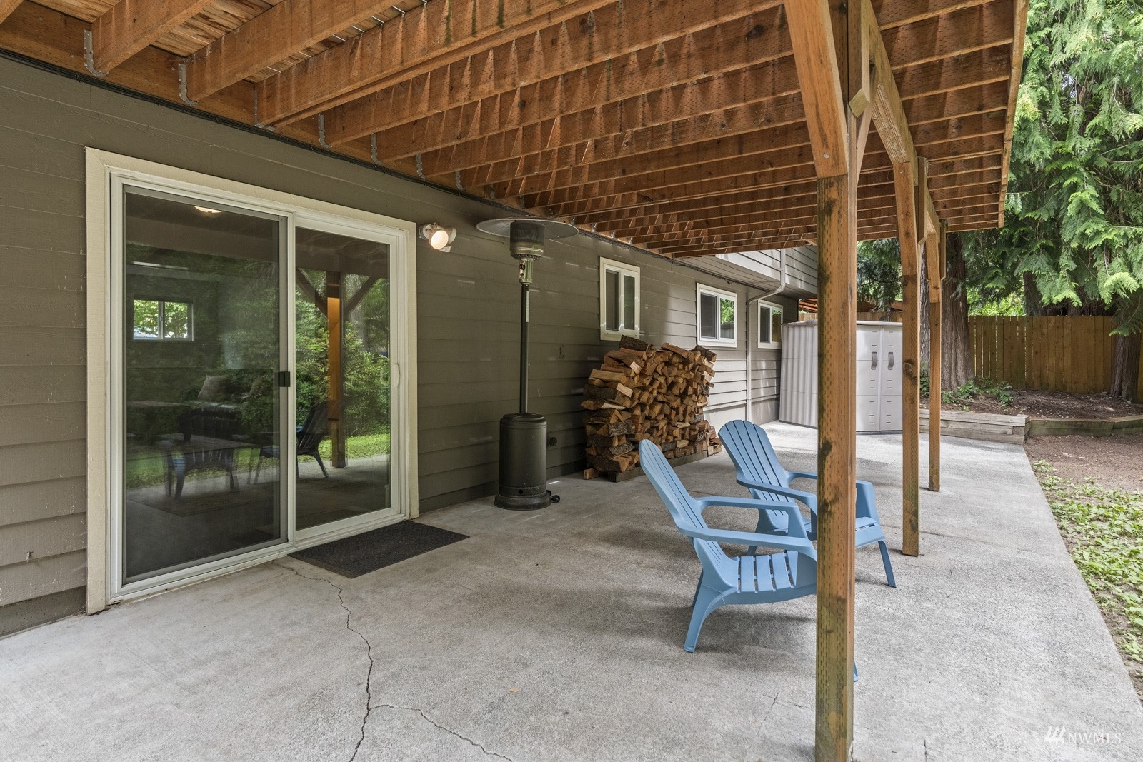 9651 Northeast 201st Street Bothell, WA 98011 - Photo 31 of 39 a view of a porch with dining table and chairs