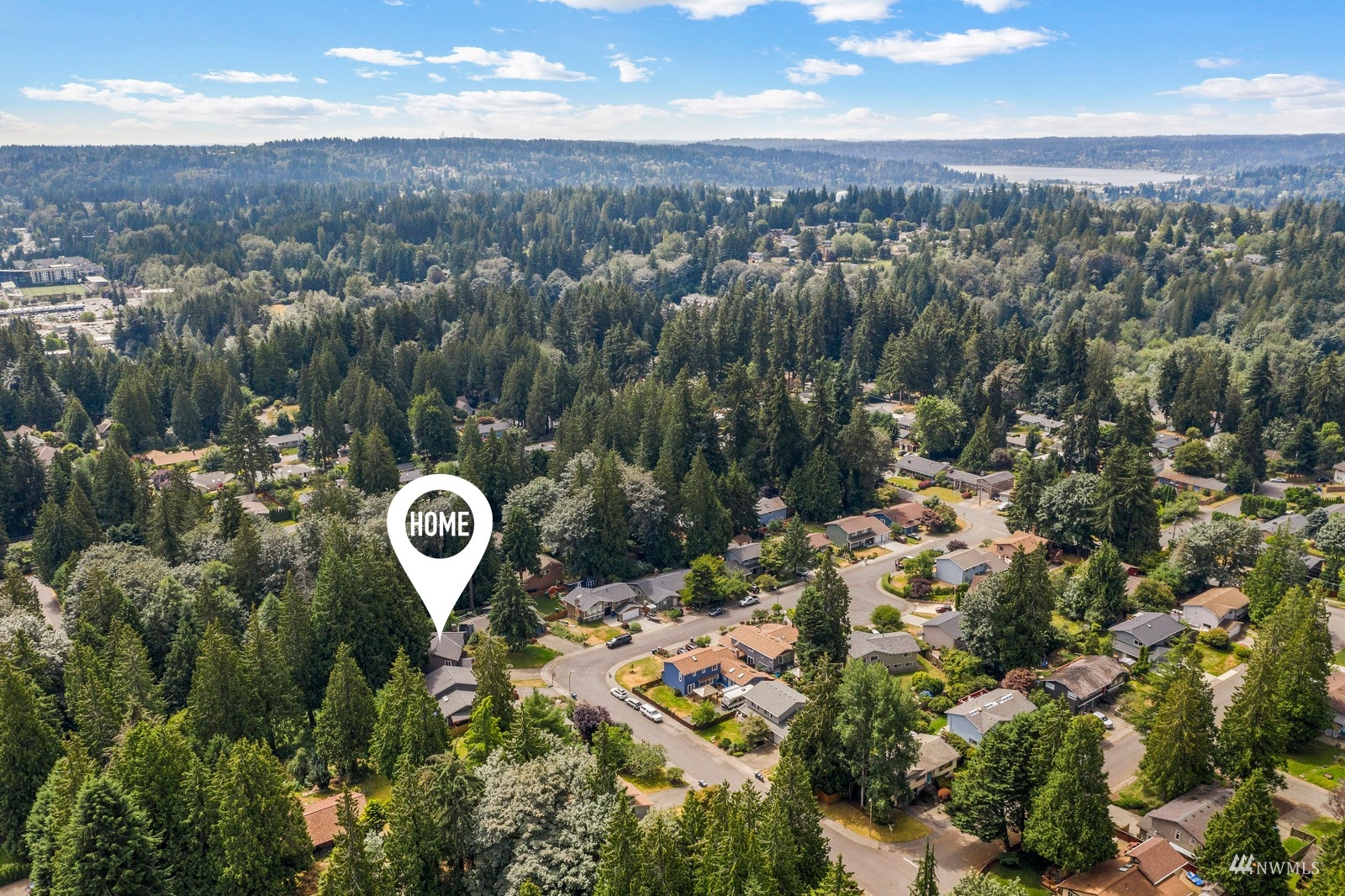 9651 Northeast 201st Street Bothell, WA 98011 - Photo 36 of 39 an aerial view of a house with a yard lake view and mountain view in back