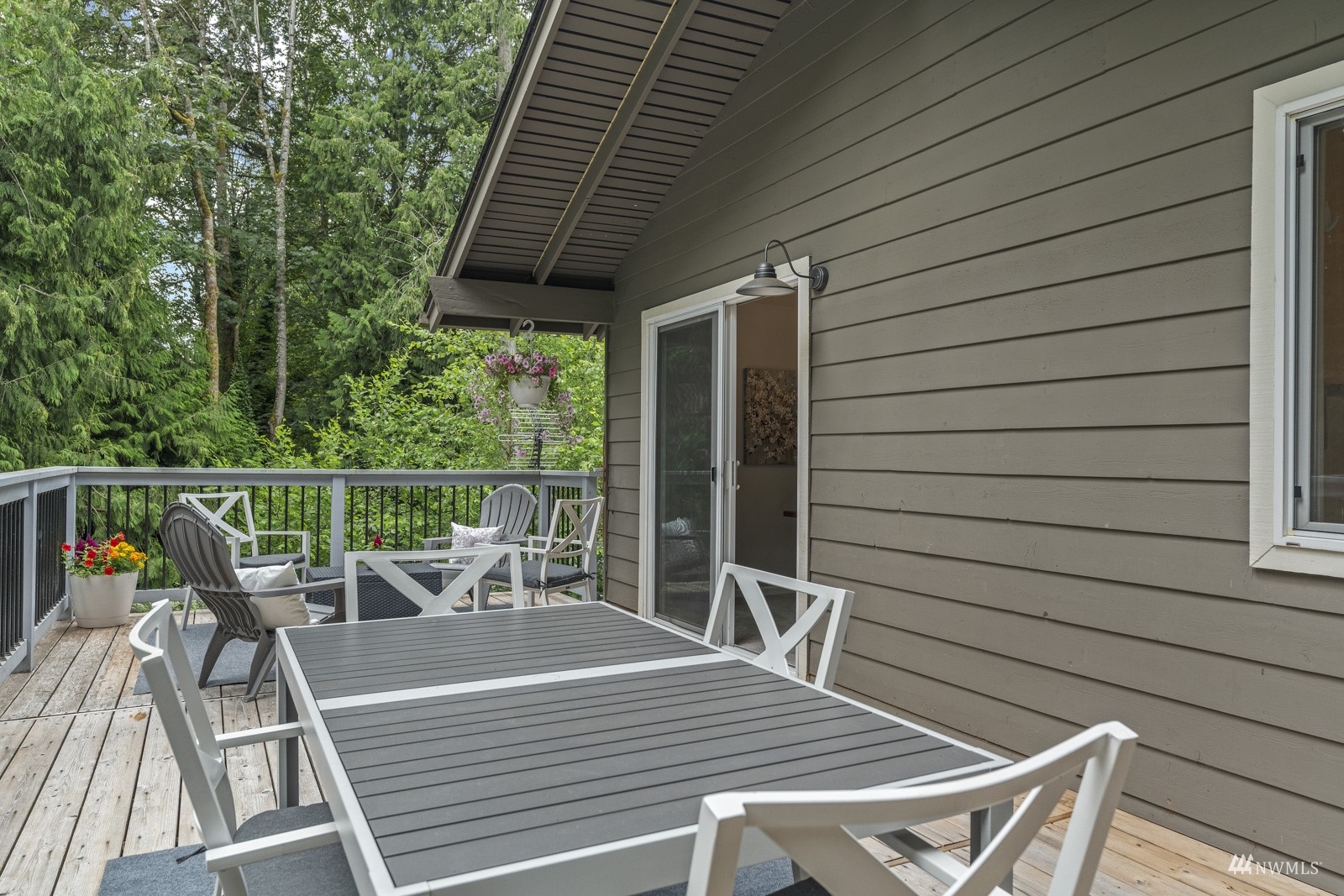 9651 Northeast 201st Street Bothell, WA 98011 - Photo 10 of 39 a view of a chairs and table on the wooden floor