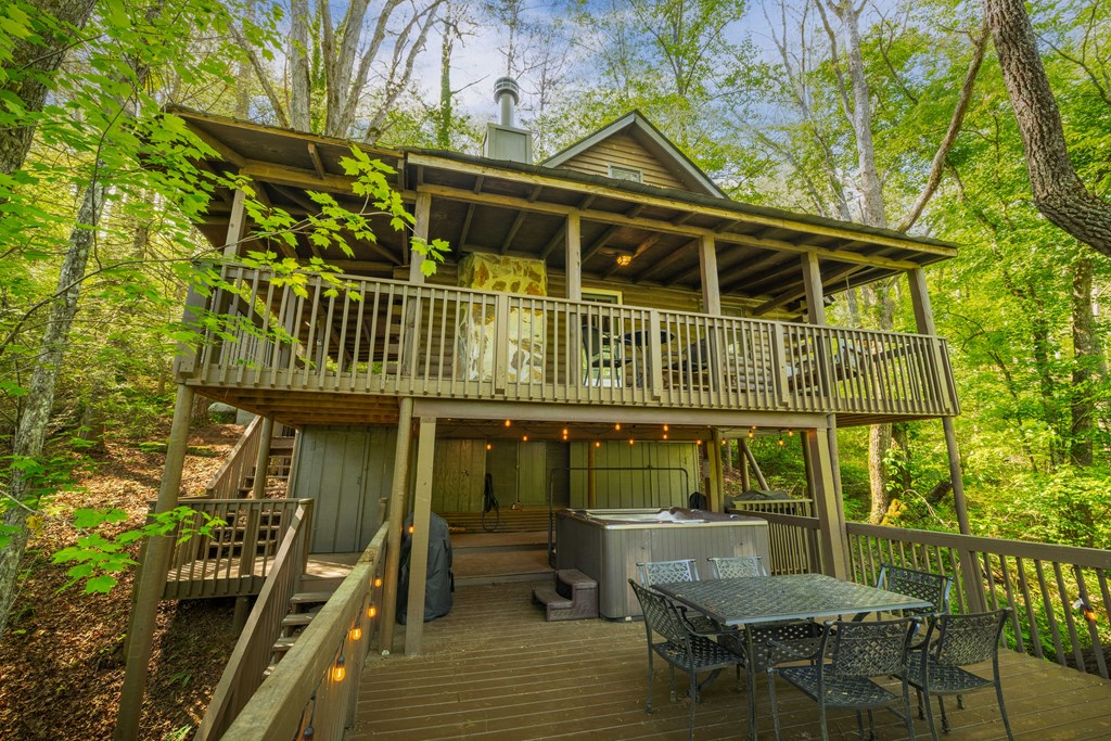 459 Mill Stone Mountain Lane Blue Ridge, GA 30513 - Photo 13 of 25 a view of a chair and table in the balcony
