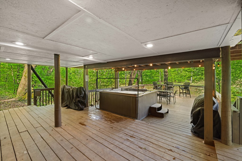459 Mill Stone Mountain Lane Blue Ridge, GA 30513 - Photo 16 of 25 a view of a patio with wooden floor and outdoor space