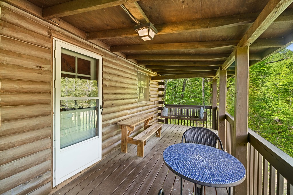 459 Mill Stone Mountain Lane Blue Ridge, GA 30513 - Photo 25 of 25 a outdoor living space with furniture and a potted plant