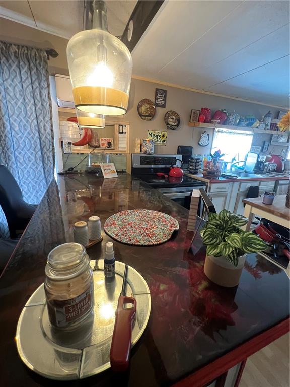 1005 Whitehurst Road, Unit 92 Plant City, FL 33563 - Photo 13 of 29 a living room with furniture and a chandelier