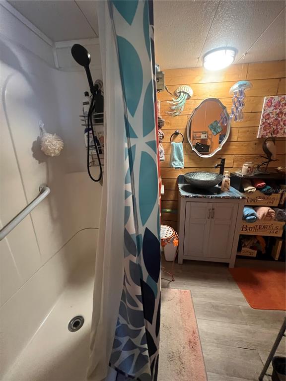 1005 Whitehurst Road, Unit 92 Plant City, FL 33563 - Photo 23 of 29 a bathroom with a sink mirror vanity and shower