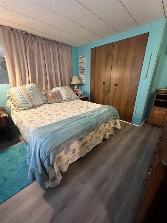 1005 Whitehurst Road, Unit 92 Plant City, FL 33563 - Photo 27 of 29 a bedroom with a bed and a mirror