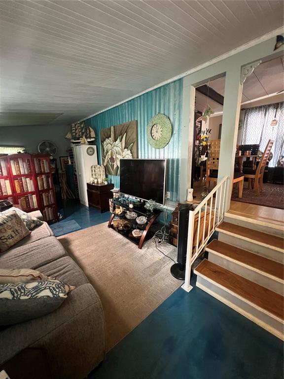 1005 Whitehurst Road, Unit 92 Plant City, FL 33563 - Photo 7 of 29 a bedroom with furniture and a flat screen tv