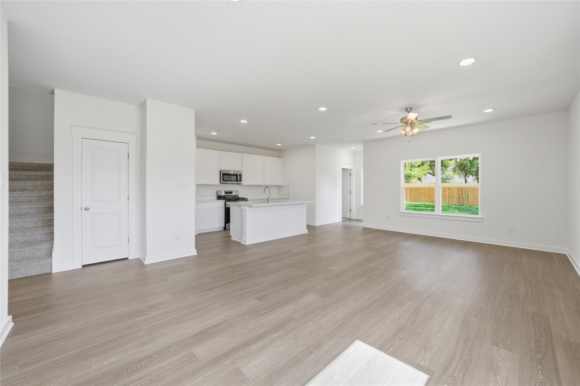 13501 Barn Chime Street Elgin, TX 78621 - Photo 4 of 19 a view of empty room with wooden floor