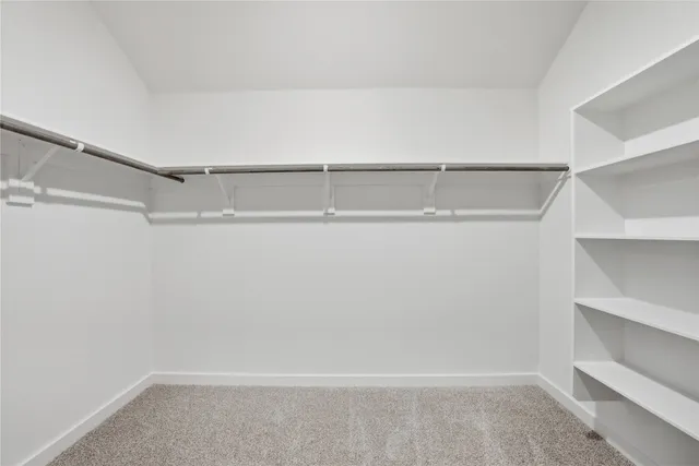 a view of an empty walk in closet
