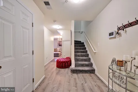 a view of entryway with wooden floor