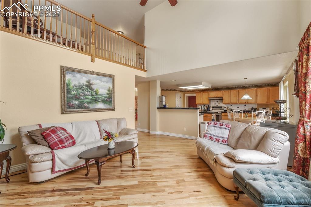 8654 Champie Road Peyton, CO 80831 - Photo 12 of 40 a living room with furniture and a view of kitchen