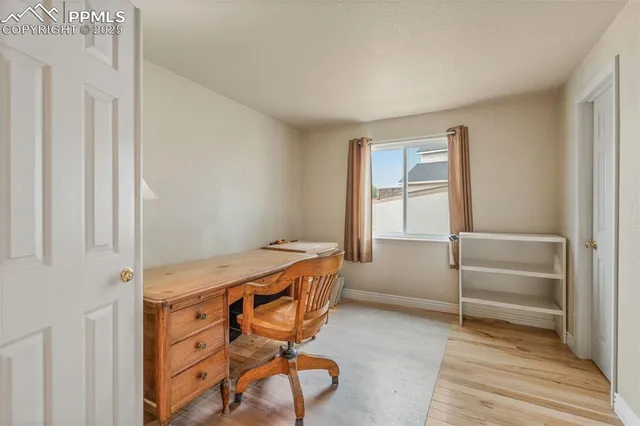 a room that has a bed and a window in it