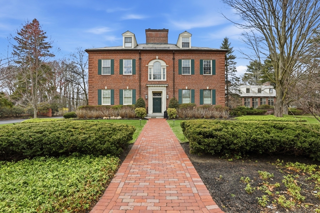 83 Church Street, Unit 15 Winchester, MA 01890 - Photo 1 of 34 a front view of a house with a yard